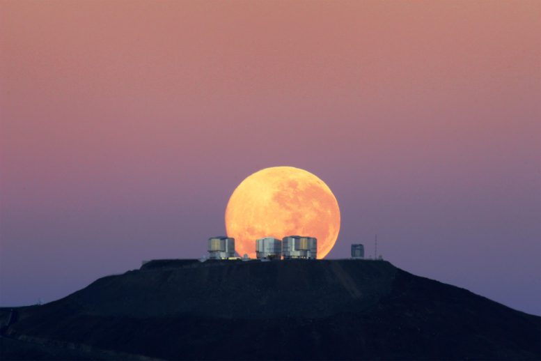 The dramatic moon behind ESO's Very Large Telescope