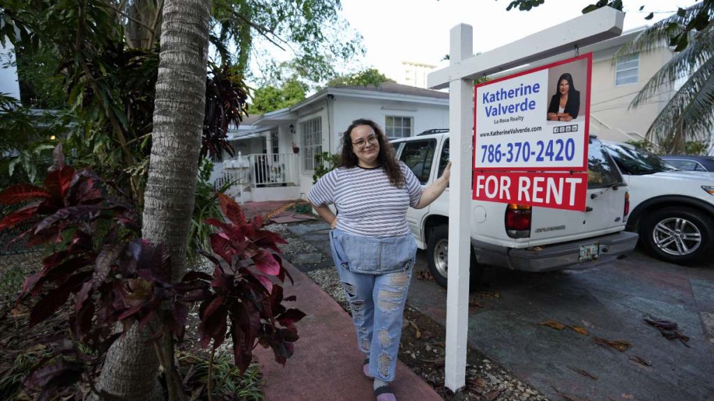 Krystal Guerra, 32, poses for a picture outside her apartment, which she has to leave after her new landlord gave her less than a month's notice that her rent would go up by 26%, Feb. 12, in the Coral Way neighborhood of Miami.