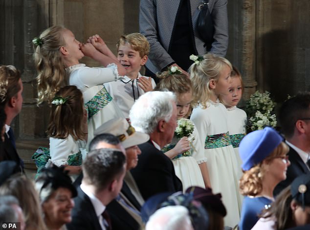 Cheeky Savannah Phillips held Prince George as they prepared to walk down the aisle with Princess Eugenie, seemingly imitating the trumpet noise that heralded the Queen's arrival. 