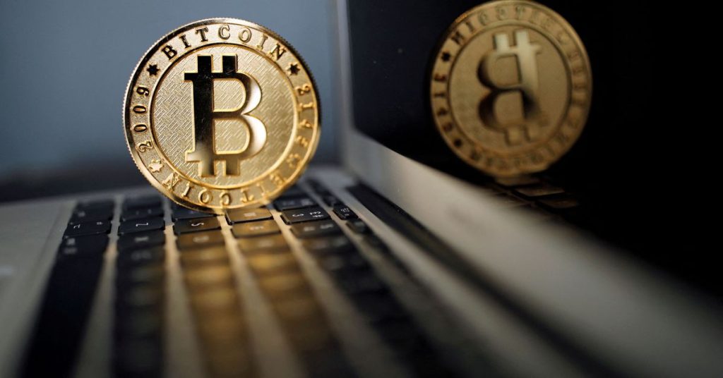 Bitcoin drops to 10-month low as stock markets falter