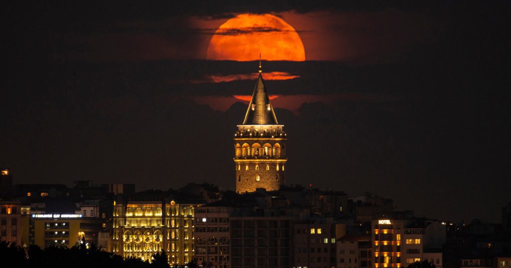 The giant strawberry moon lights up the sky, and it was the lowest moon of the year