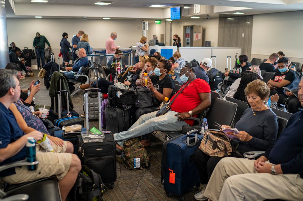 Passengers waiting to board a JetBlue plane at a terminal at Fort Lauderdale-Hollywood International Airport.