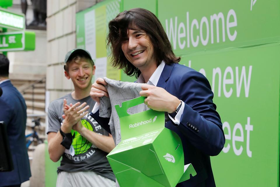 Robinhood Markets, Inc.  CEO and co-founder Vlad Tenev holds a T-shirt on Wall Street after the company's IPO in New York City, US, July 29, 2021. REUTERS/Andrew Kelly